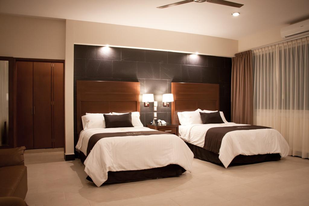 סילאו Hotel Ecce Inn & Spa חדר תמונה A bedroom at the hotel